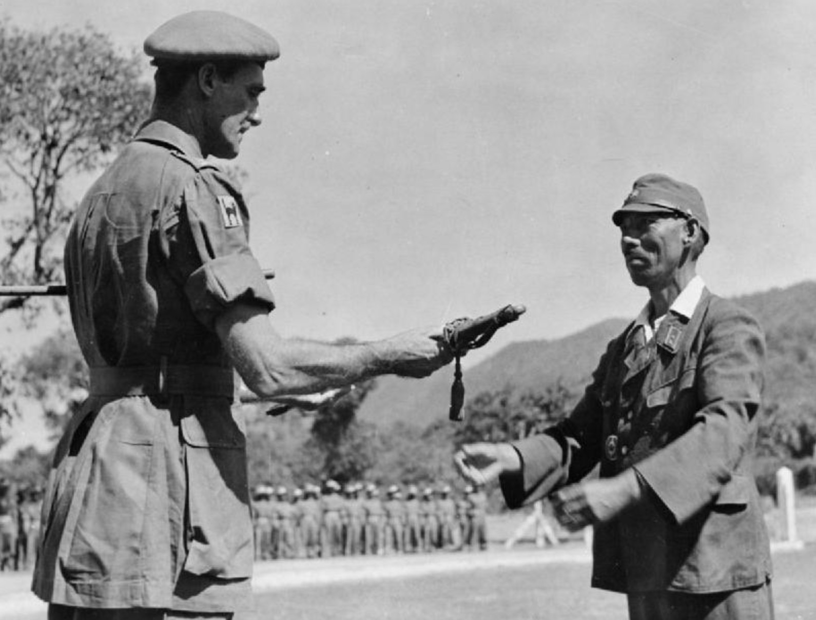Lieutenant General Kawada, commander of the Japanese 31st Division, surrenders to Major General Arthur W Crowther, DSO, commander of the 17th Indian Division, near Moulmein, Burma. 